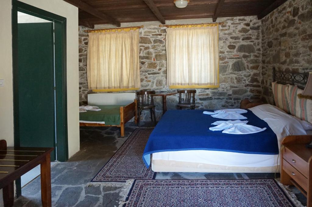 Postel nebo postele na pokoji v ubytování Akontisma