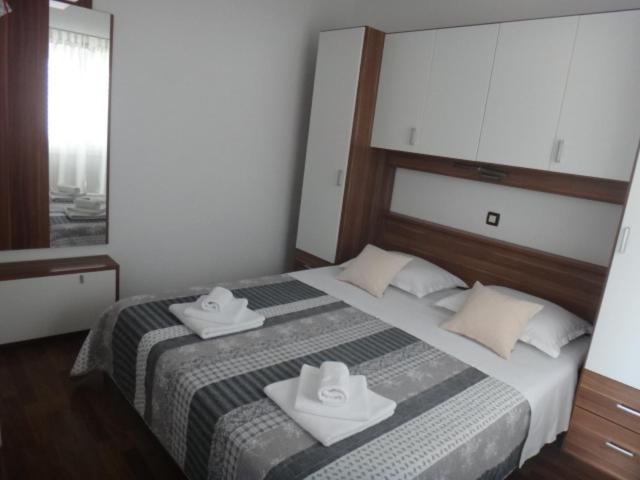 Posteľ alebo postele v izbe v ubytovaní Apartments Selina