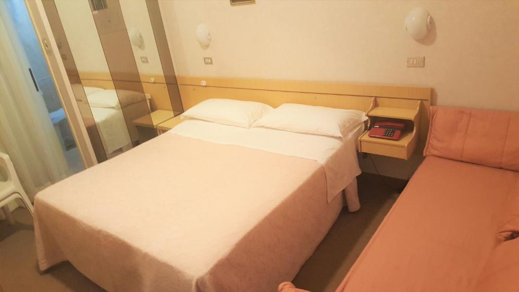 Postel nebo postele na pokoji v ubytování Hotel Ida
