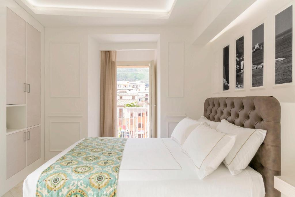 Łóżko lub łóżka w pokoju w obiekcie Townhouse Tropea
