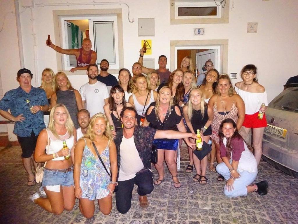 a group of people posing for a picture at a party at Cloud 9 Hostel in Lagos