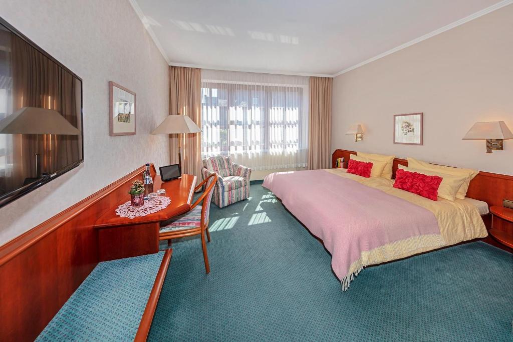 Postel nebo postele na pokoji v ubytování Wittlers Hotel
