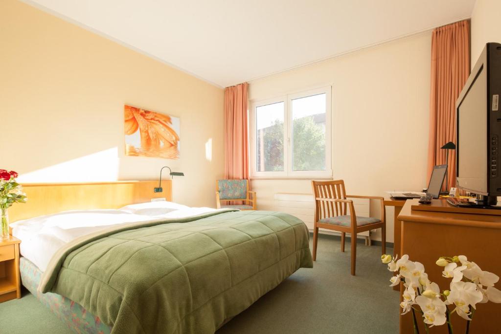 Voodi või voodid majutusasutuse Apart Hotel Gera toas