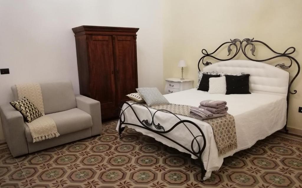 Postel nebo postele na pokoji v ubytování Agorà Suites & Apartments