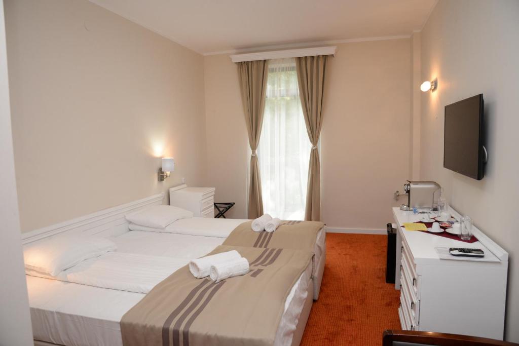 Postel nebo postele na pokoji v ubytování Zepter Hotel Vrnjacka Banja, member of Zepter Hotels