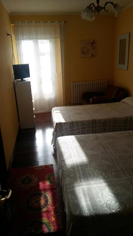 Posteľ alebo postele v izbe v ubytovaní Pensión Casa Frade