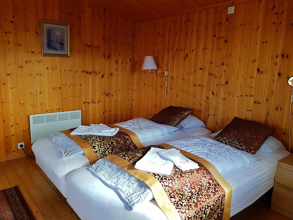 Postel nebo postele na pokoji v ubytování Hótel Bjarkalundur