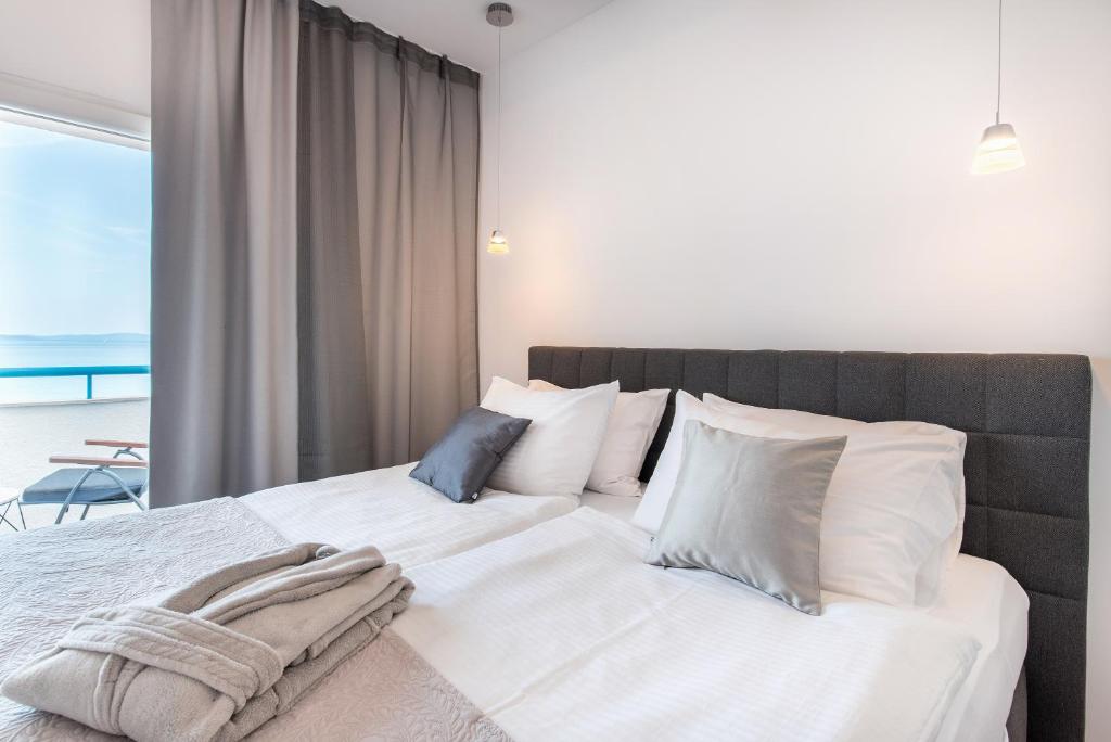 Posteľ alebo postele v izbe v ubytovaní Beachfront Apartments Zanic