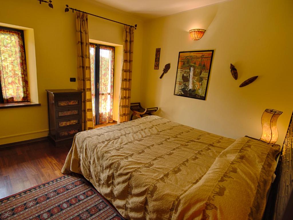 Postel nebo postele na pokoji v ubytování B&B Il Sole Delle Rive