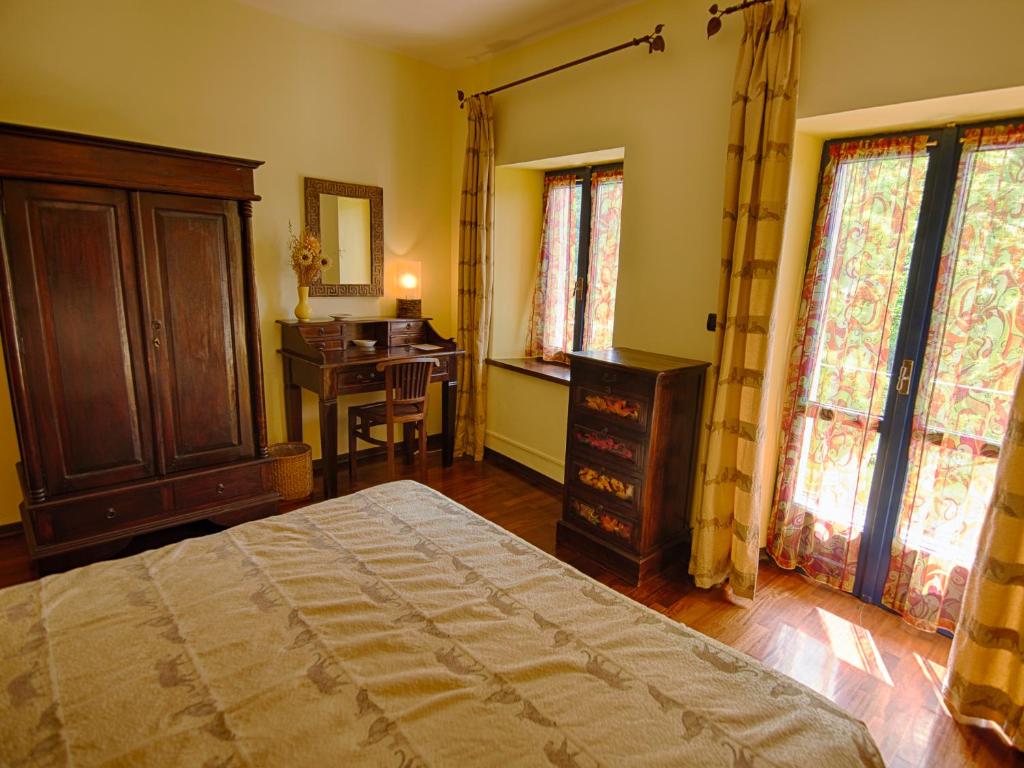 Postel nebo postele na pokoji v ubytování B&B Il Sole Delle Rive