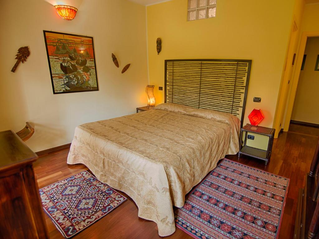 Postel nebo postele na pokoji v ubytování B&B Il Sole Delle Rive