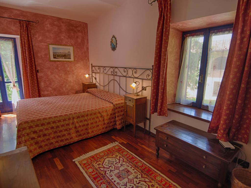 Postel nebo postele na pokoji v ubytování B&B Il Sole Delle Rive