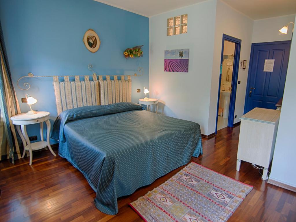 Postel nebo postele na pokoji v ubytování B&B Il Sole Delle Rive