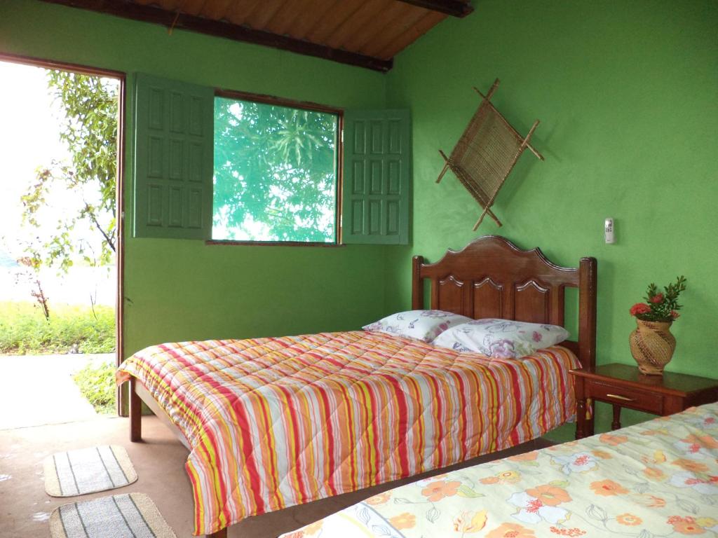 Postel nebo postele na pokoji v ubytování Anaconda Amazon Island
