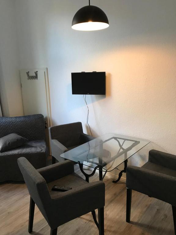 TV a/nebo společenská místnost v ubytování Apartment am Wall