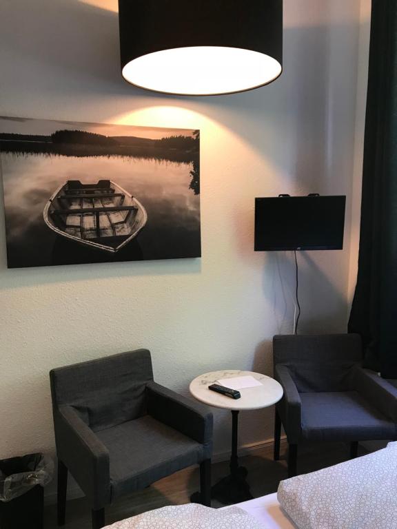 TV a/nebo společenská místnost v ubytování Apartment am Wall
