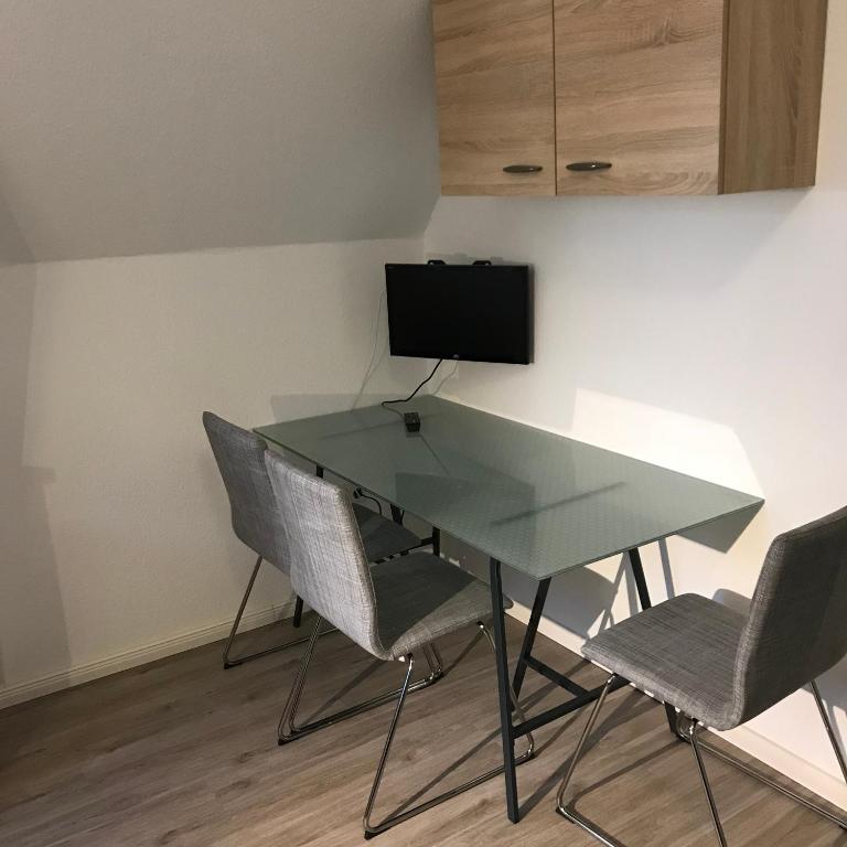 TV a/nebo společenská místnost v ubytování Apartment am Wall