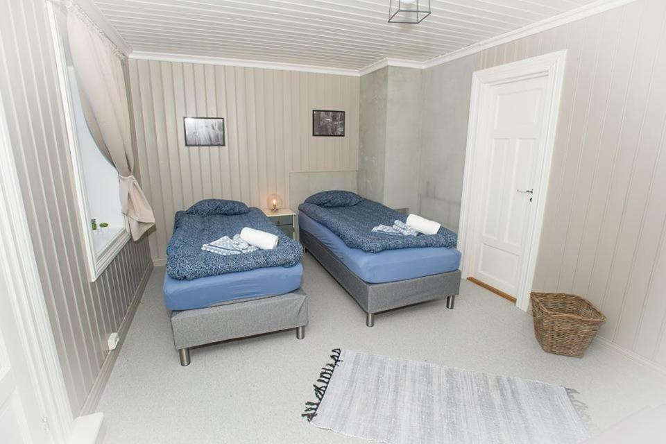 Postel nebo postele na pokoji v ubytování Vrangfoss Sluse