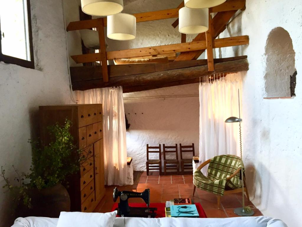 a living room with a couch and a table at Casa Yolanda in Bojar