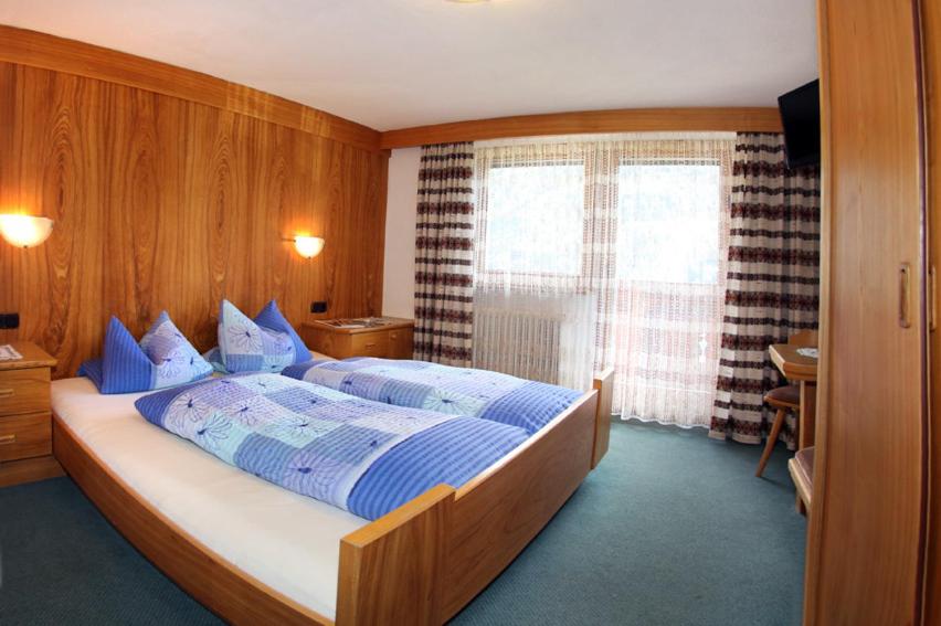 Postel nebo postele na pokoji v ubytování Haus Gritsch