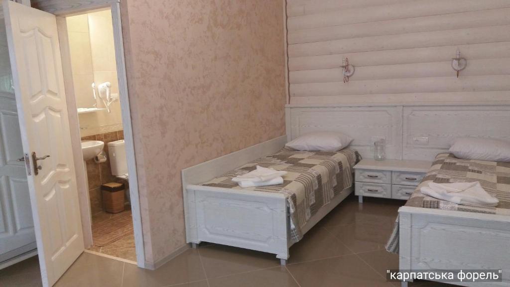 Postel nebo postele na pokoji v ubytování Karpatska Forel