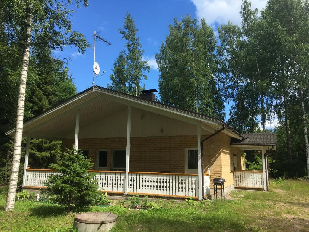 a house with a flag on top of it at Foxy burrow in Verla