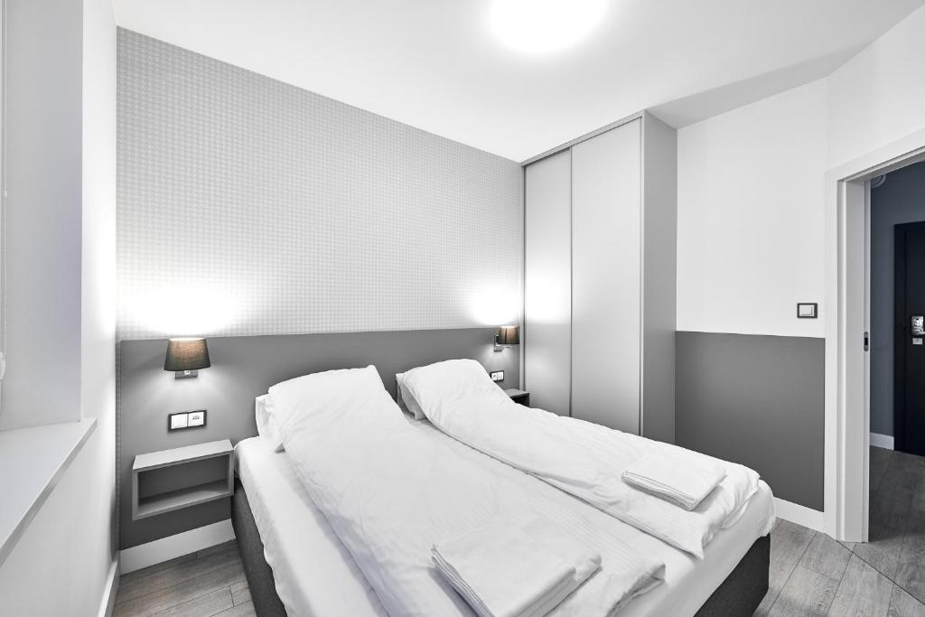 Posteľ alebo postele v izbe v ubytovaní Apartamenty Między Jeziorami - Free Parking, FV