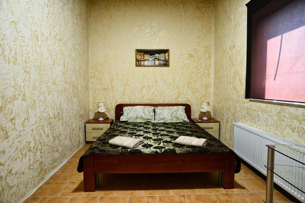 Postel nebo postele na pokoji v ubytování Logovo Hostel