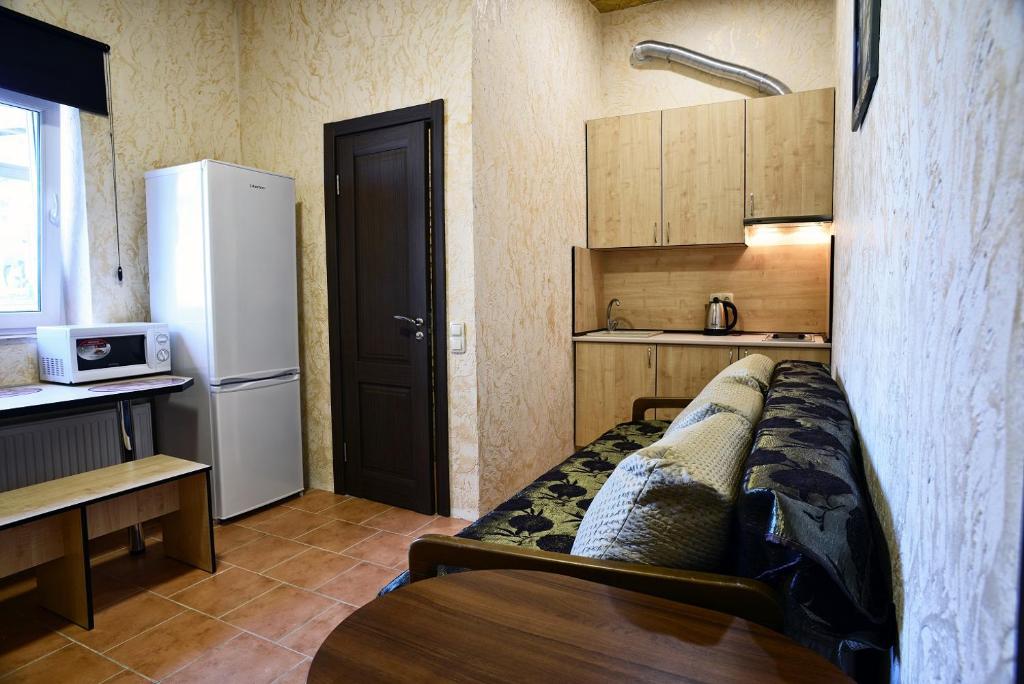 Kuchyň nebo kuchyňský kout v ubytování Logovo Hostel