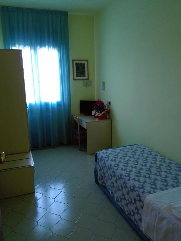 Postel nebo postele na pokoji v ubytování Hotel Senio