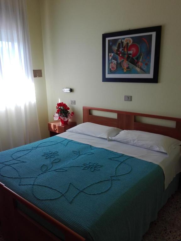 Postel nebo postele na pokoji v ubytování Hotel Senio