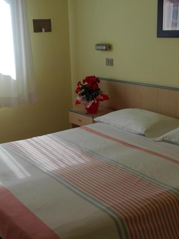 Postel nebo postele na pokoji v ubytování Hotel Senio