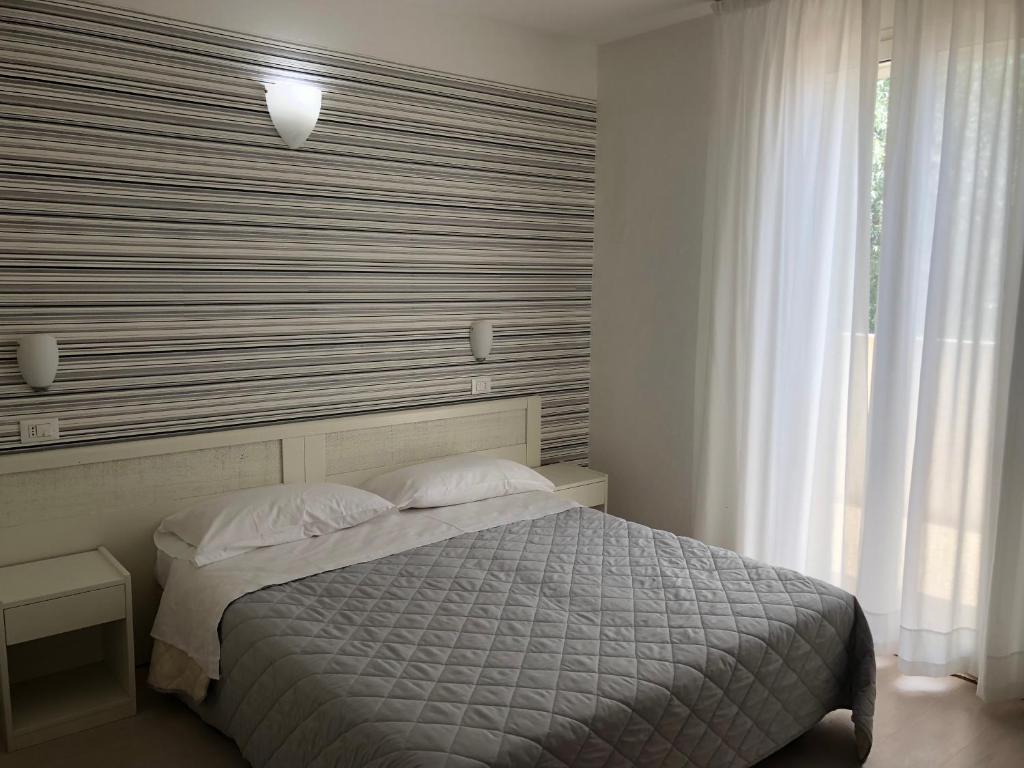 Llit o llits en una habitació de Hotel Stella Polare