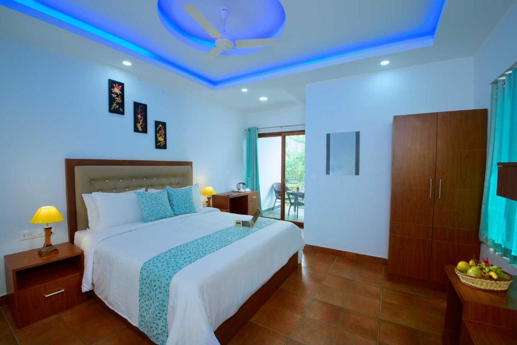 Postel nebo postele na pokoji v ubytování Spice Villa Thekkady