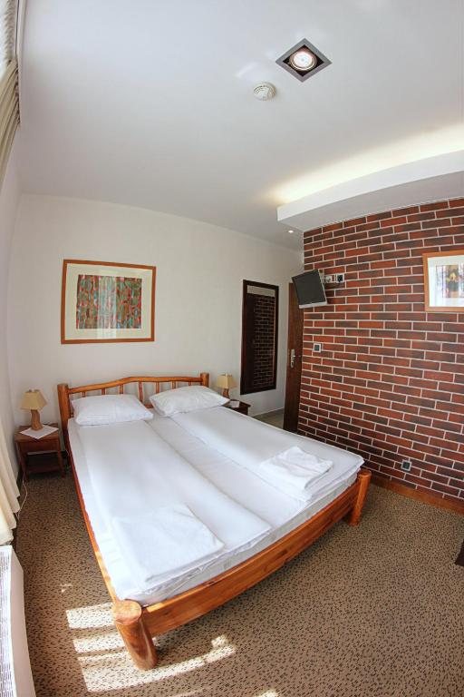 Кровать или кровати в номере Hotel Olecki