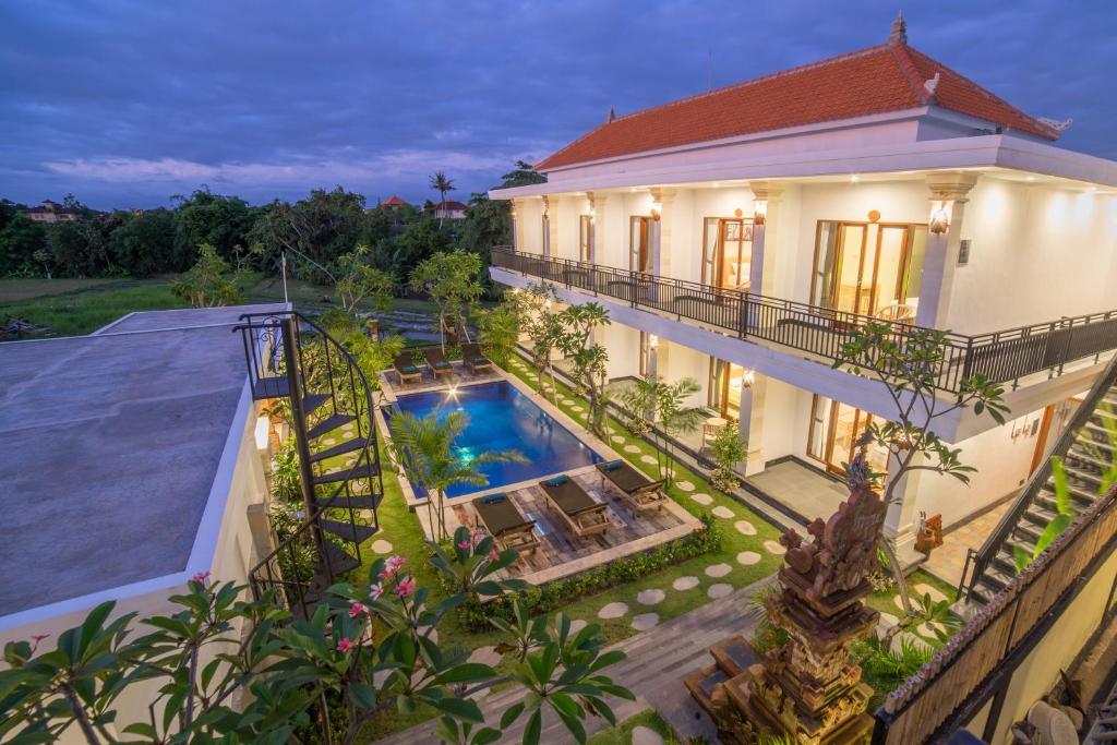 an aerial view of a house with a swimming pool at Lila Loka Homestay in Canggu