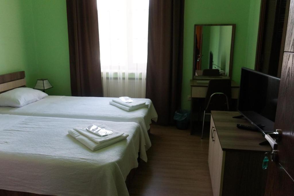 Postel nebo postele na pokoji v ubytování Villa Qero