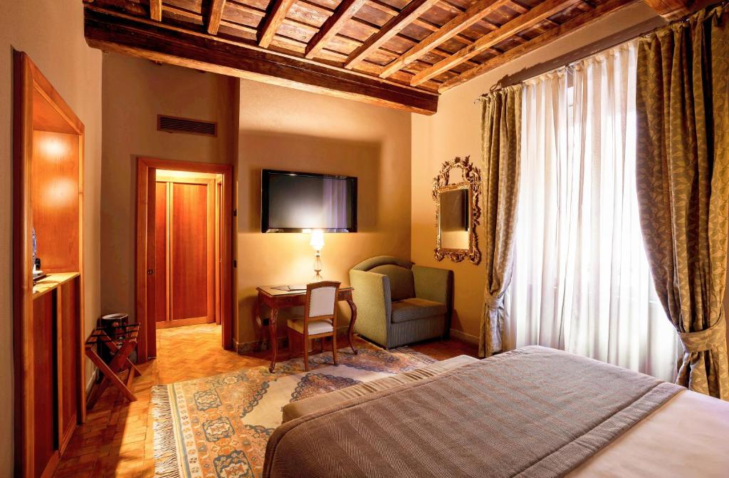 Postel nebo postele na pokoji v ubytování Hotel Valadier