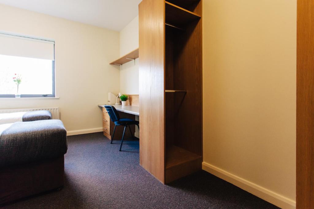 Postel nebo postele na pokoji v ubytování DCU Apartments