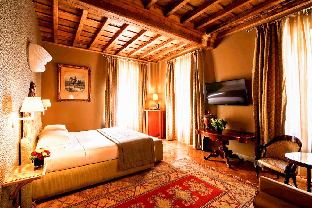 Postel nebo postele na pokoji v ubytování Hotel Valadier