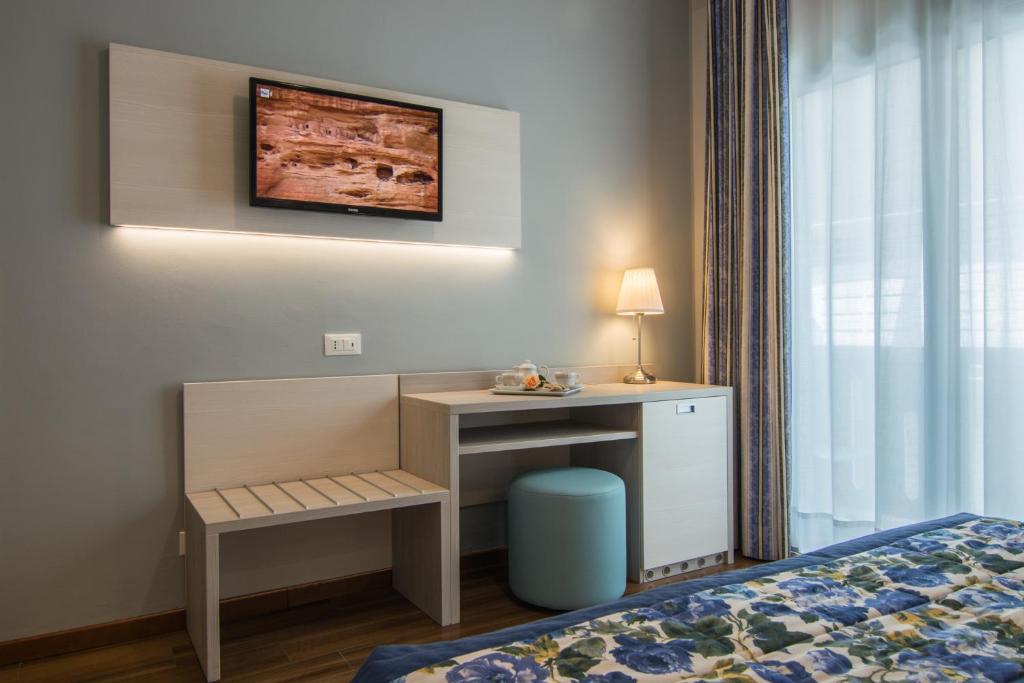Postel nebo postele na pokoji v ubytování Hotel Doriana