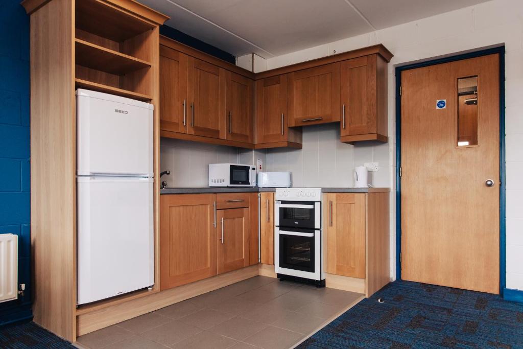 Kuchyň nebo kuchyňský kout v ubytování DCU Apartments