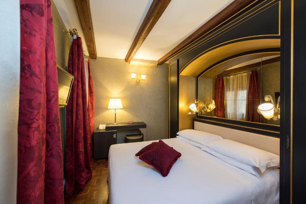 Postel nebo postele na pokoji v ubytování Hotel Campiello