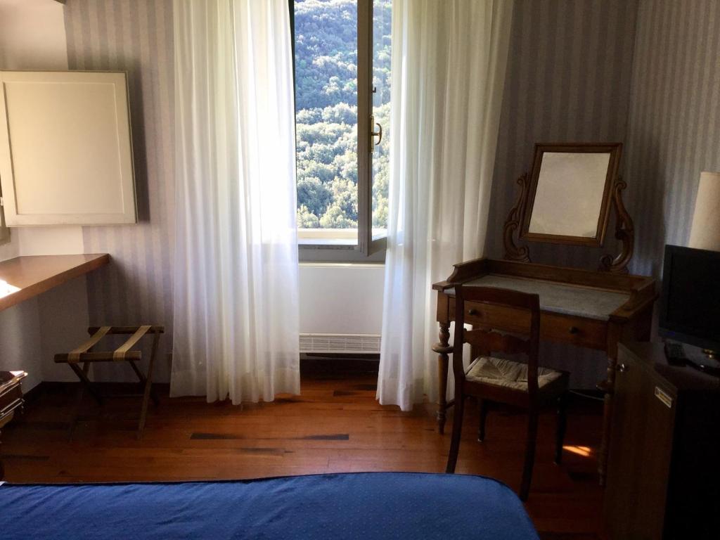 Postel nebo postele na pokoji v ubytování Hotel Gattapone