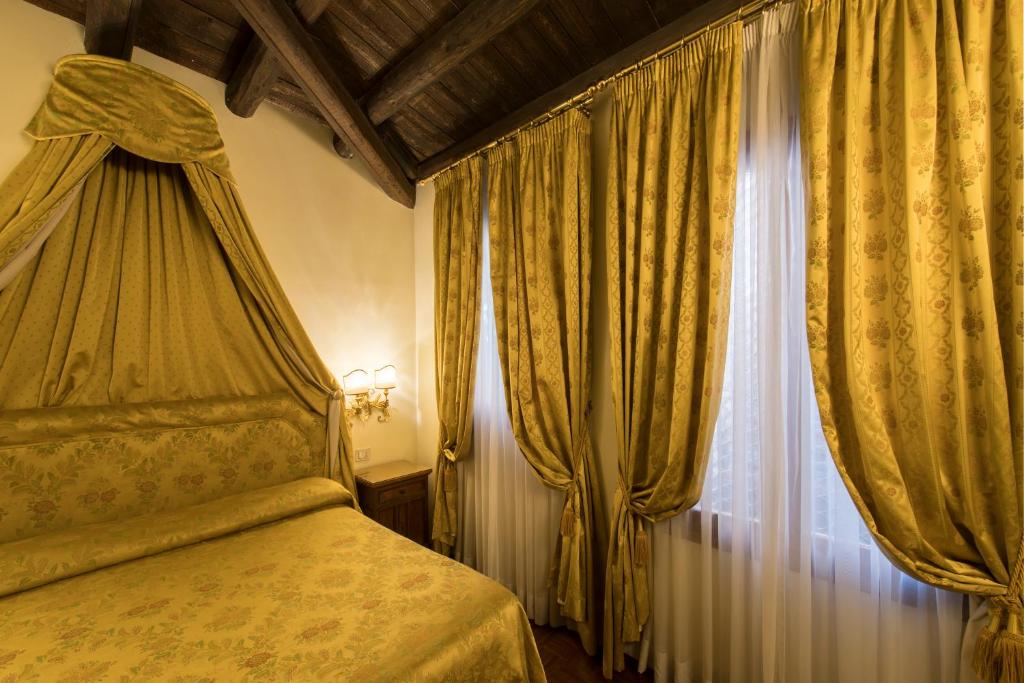 Postel nebo postele na pokoji v ubytování Hotel Campiello
