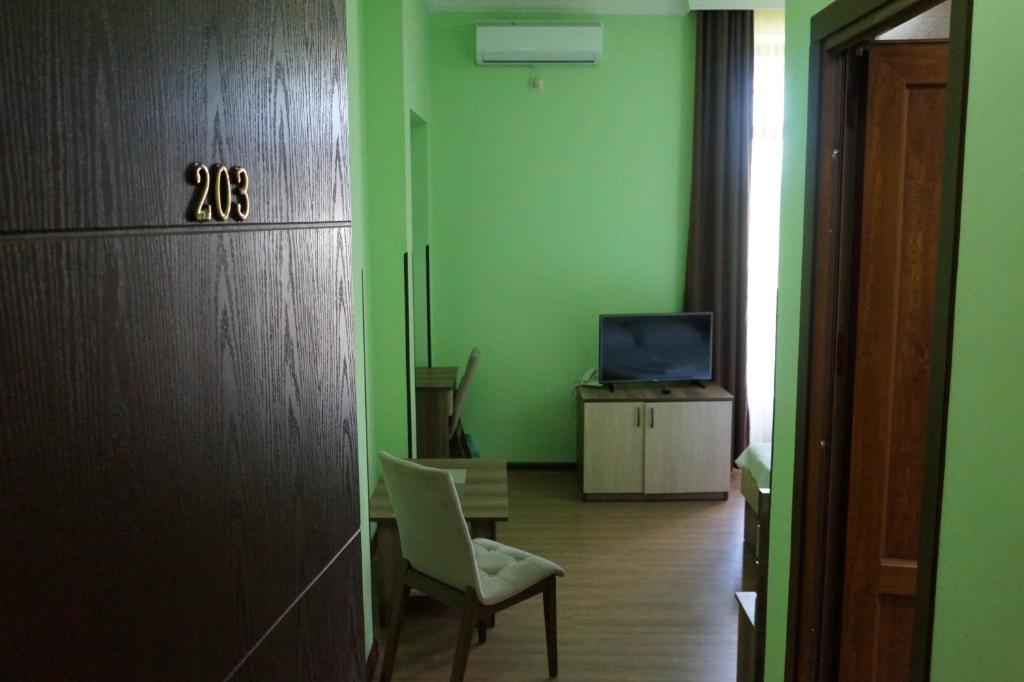 TV a/nebo společenská místnost v ubytování Villa Qero