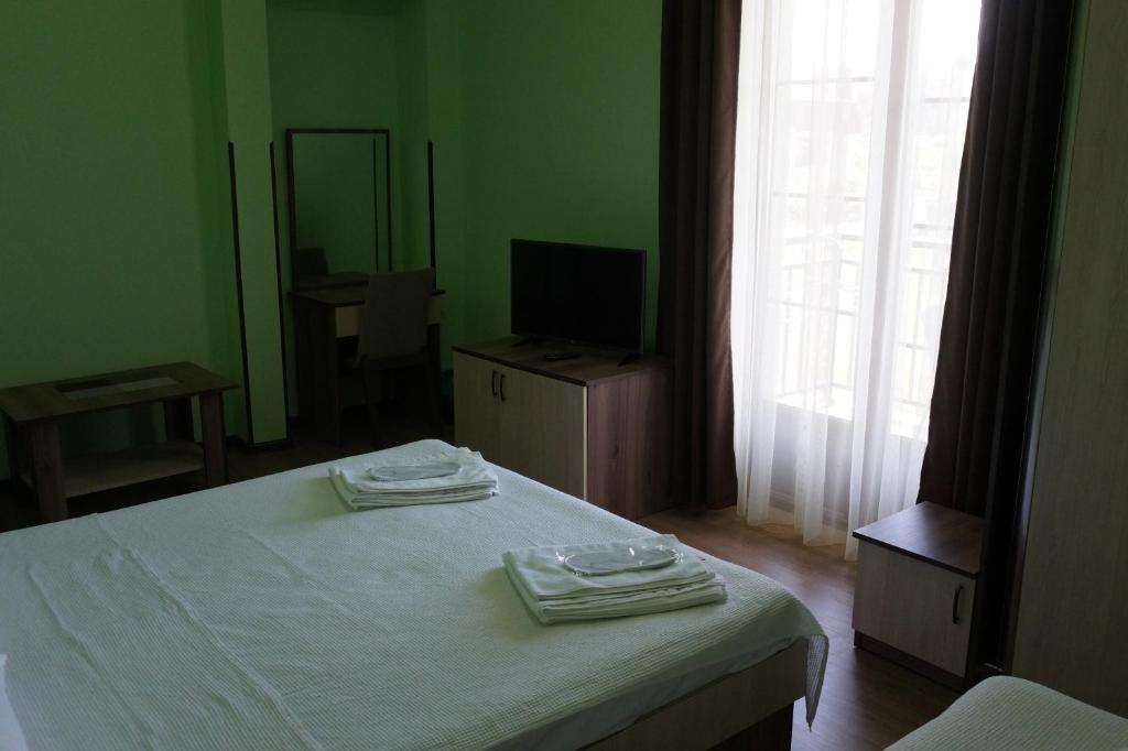 Postel nebo postele na pokoji v ubytování Villa Qero