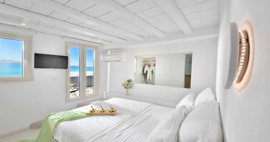 A bed or beds in a room at Little Venice Suites