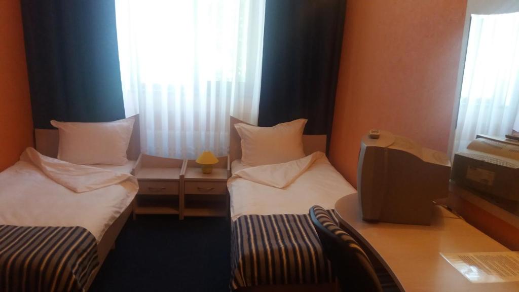 Postel nebo postele na pokoji v ubytování Hotel Perfect