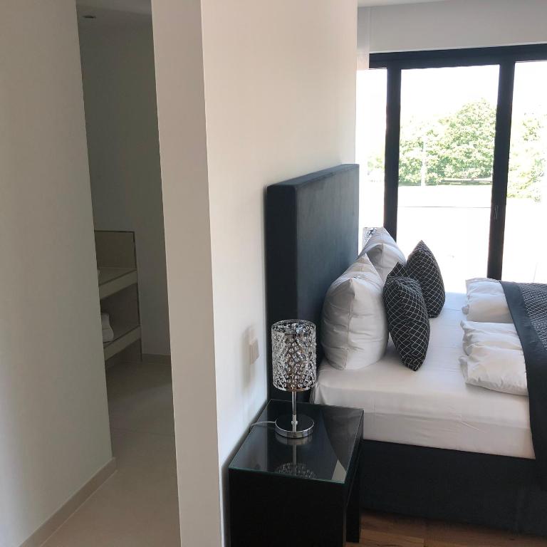 Postel nebo postele na pokoji v ubytování Voss Villa